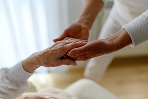 Pflege einer Älteren Person &copy; AdobeStock js-photo